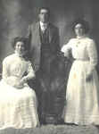 Photograph taken on the occasion of Rachel Victoria Hudson's marriage to Harry Harris held in November 1911 in Clunes. The bride is seated on the left, and Ruby Jane Hudson is standing on the right. Joseph Edmund gave the bride away and Ruby Jane was one of the bridesmaids.